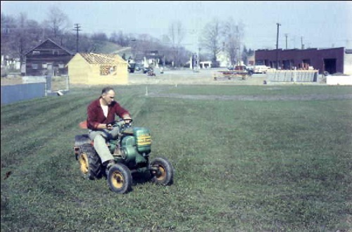 Bill M. rolling the Chester Little League Field, looking east at Conklin’s Lumber Yard. April, 1958 chs-009259